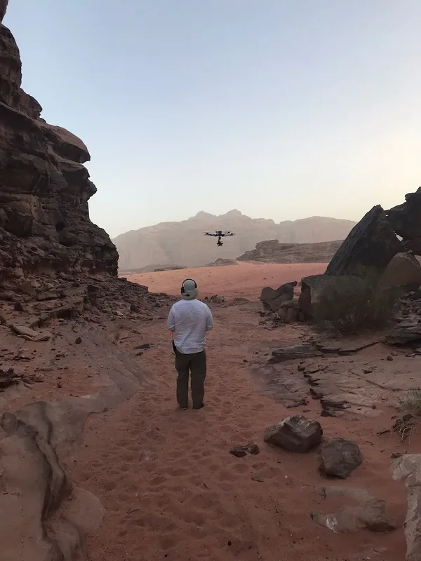 Aidan Kelly operating a cinema drone in a Wadi Rum canyon