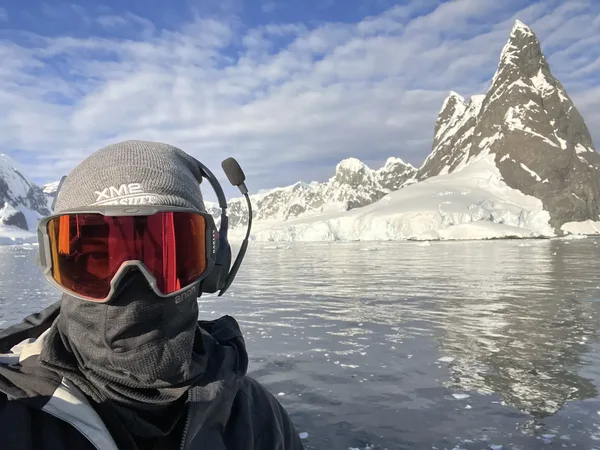 Aidan Kelly drone pilot in extreme cold conditions with glacier