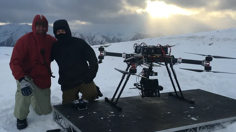 Aidan Kelly with heavy-lift cinema drone in snow-covered mountains